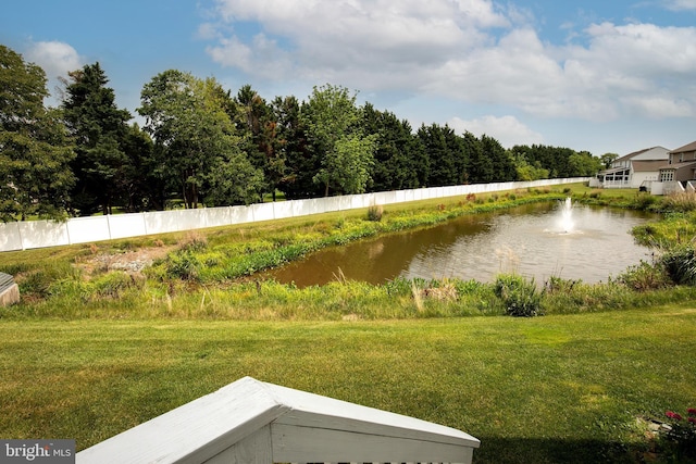 31142 Mills Chase Dr Unit 9, Lewes, DE 19958 - view of green lawn featuring a water view