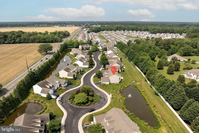 31142 Mills Chase Dr Unit 9, Lewes, DE 19958 - aerial view of property and surrounding area featuring a large body of water and nearby suburban area