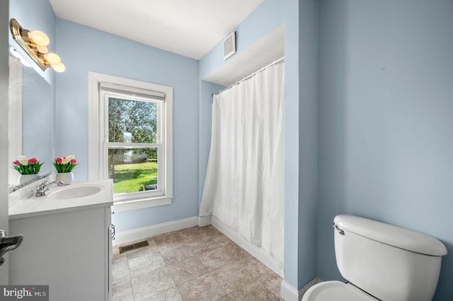 225 S Hanover St, Pottstown, PA 19465 - full bathroom with baseboards, vanity, toilet, and a shower with shower curtain