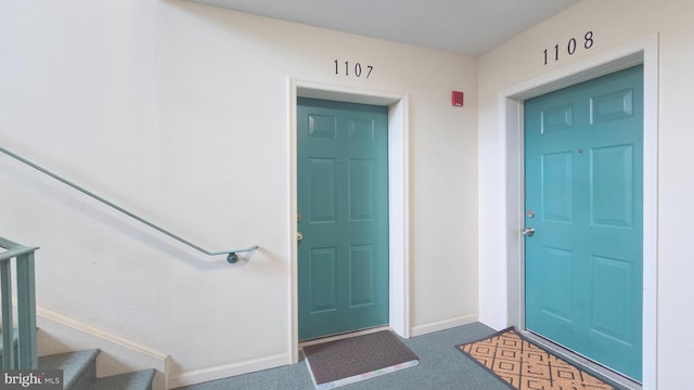 entrance to property with stucco siding