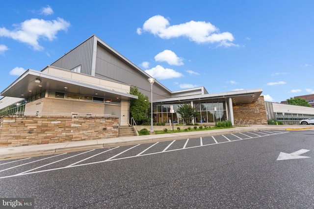 view of property featuring uncovered parking