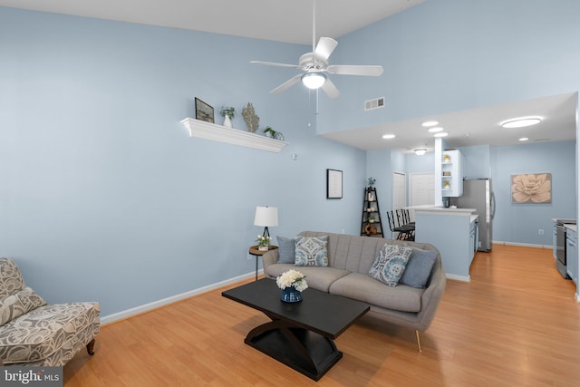 12708 Found Stone Rd Unit 3-304, Germantown, MD 20876 - living area featuring light wood-style floors, ceiling fan, and a towering ceiling