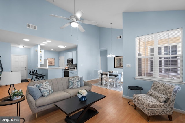 12708 Found Stone Rd Unit 3-304, Germantown, MD 20876 - living area with a chandelier, high vaulted ceiling, light wood-style flooring, and ceiling fan
