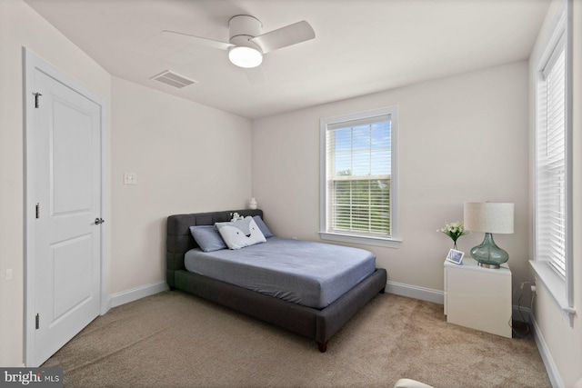 bedroom featuring carpet floors, baseboards, and ceiling fan