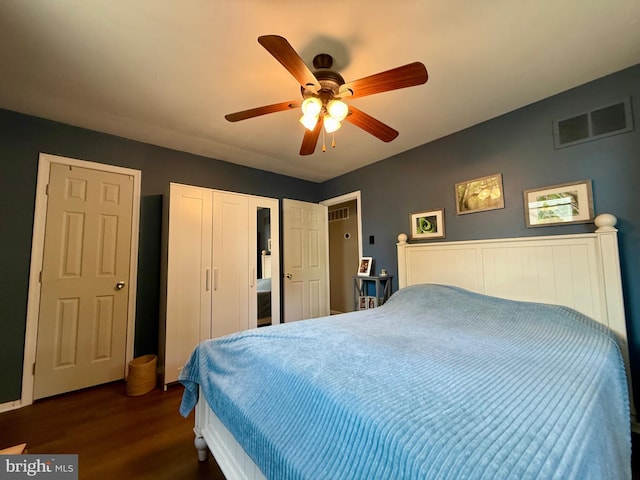 bedroom featuring dark wood-style floors and a ceiling fan
