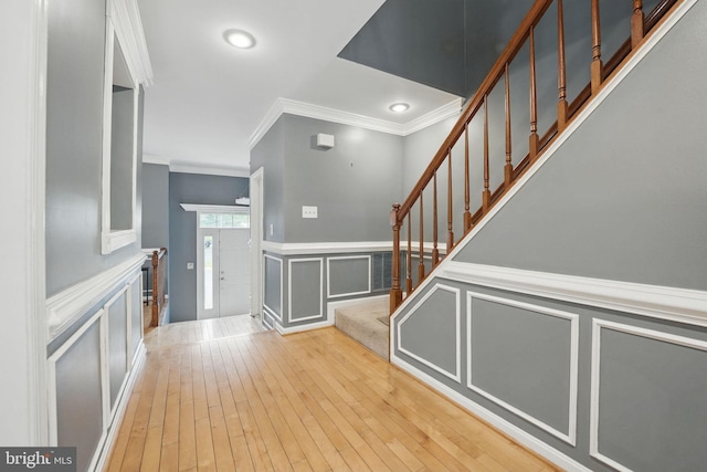 6410 Brass Button Ct, Centreville, VA 20121 - foyer entrance featuring ornamental molding, a decorative wall, stairs, light wood finished floors, and recessed lighting