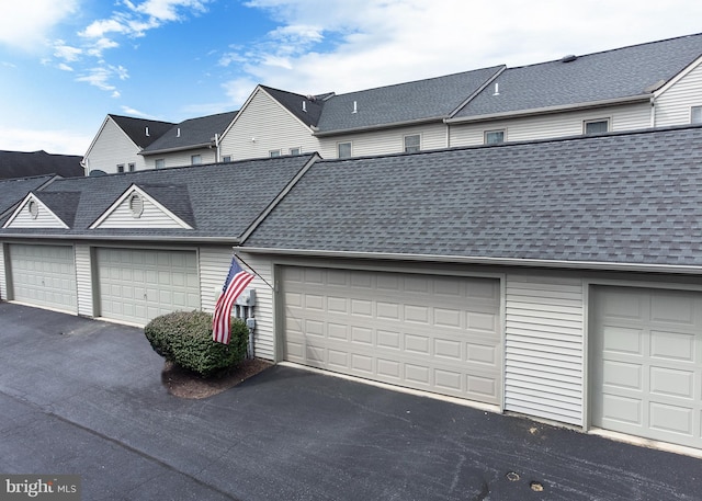 125 Wyndham Way, Harrisburg, PA 17109 - view of front of house featuring community garages and roof with shingles