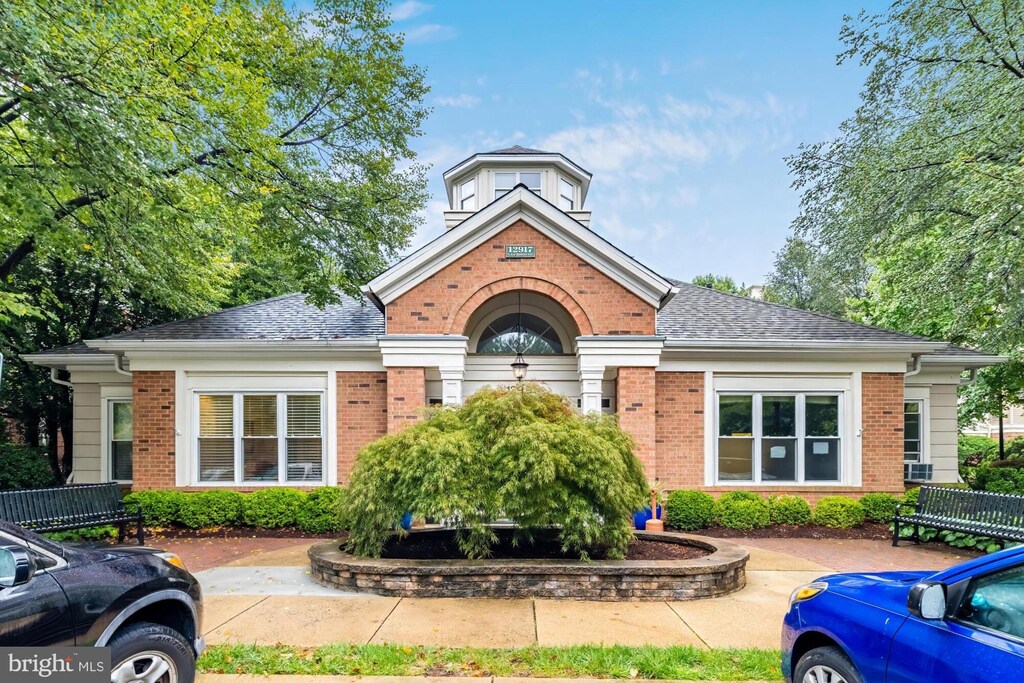2204 Westcourt Ln Unit 122, Herndon, VA 20170 - view of front of house featuring brick siding and roof with shingles
