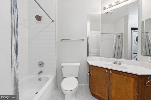 2204 Westcourt Ln Unit 122, Herndon, VA 20170 - bathroom featuring stacked washer / drying machine, tile patterned floors, vanity, shower / bath combination with curtain, and toilet