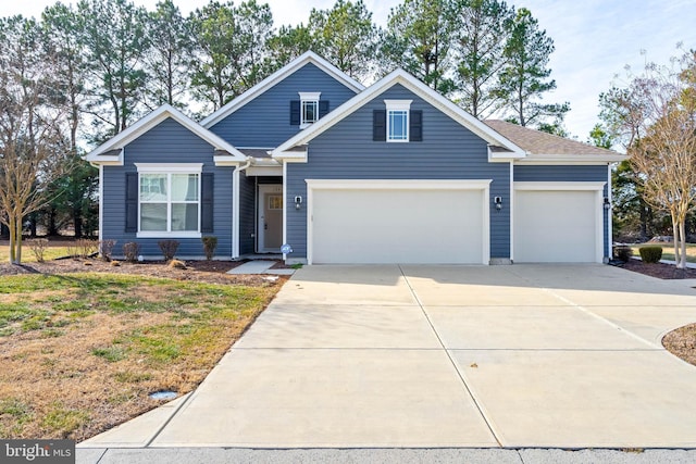 traditional home with a garage and driveway