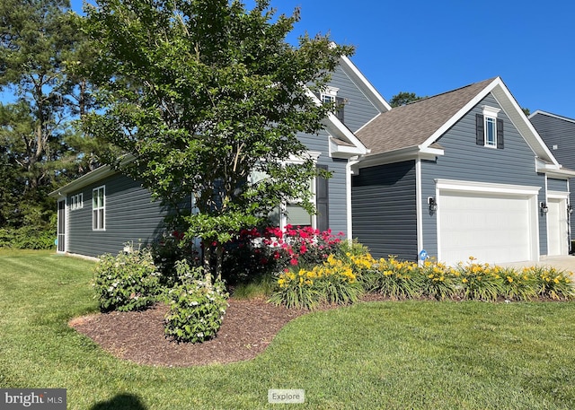 view of front of house with a front yard and a shingled roof