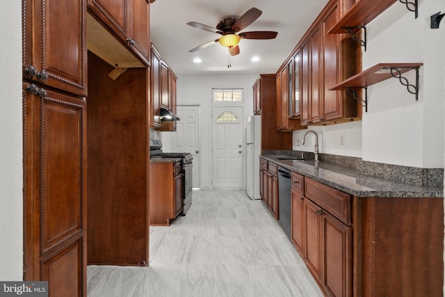 1609 E 33rd St, Baltimore, MD 21218 - kitchen featuring stainless steel gas range, a sink, freestanding refrigerator, under cabinet range hood, and a ceiling fan
