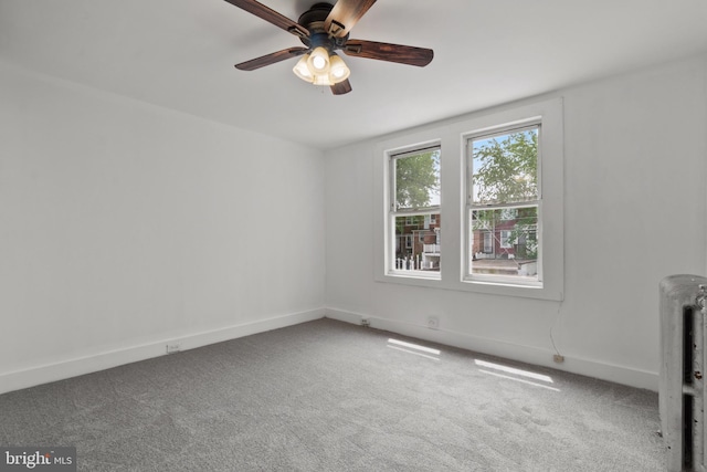 1609 E 33rd St, Baltimore, MD 21218 - carpeted spare room featuring radiator, ceiling fan, and baseboards
