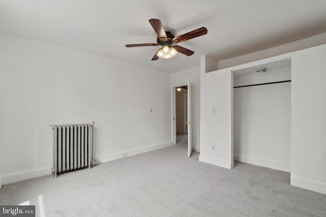1609 E 33rd St, Baltimore, MD 21218 - unfurnished bedroom with radiator, carpet, a closet, and baseboards