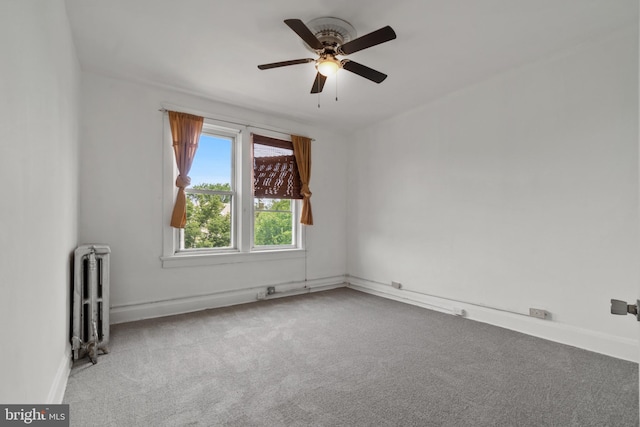 1609 E 33rd St, Baltimore, MD 21218 - unfurnished room with radiator heating unit, carpet, ceiling fan, and baseboards