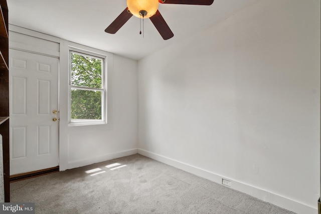 1609 E 33rd St, Baltimore, MD 21218 - spare room featuring carpet, ceiling fan, and baseboards