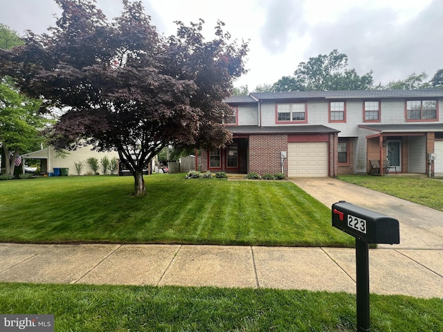 223 Foxwood Ln, Marlton, NJ 08053 - view of front of house featuring an attached garage, concrete driveway, brick siding, and a front yard