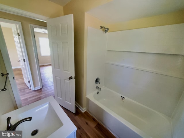 4302 Messick Rd, Rhodesdale, MD 21659 - full bath with wood finished floors, shower / bathtub combination, baseboards, and vanity