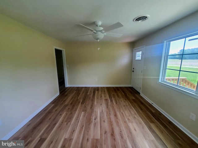 4302 Messick Rd, Rhodesdale, MD 21659 - unfurnished room with wood finished floors, baseboards, and a ceiling fan