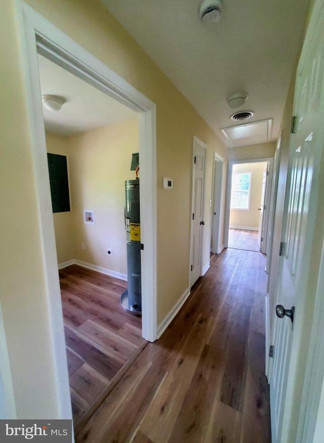 4302 Messick Rd, Rhodesdale, MD 21659 - hallway featuring water heater, wood finished floors, and baseboards