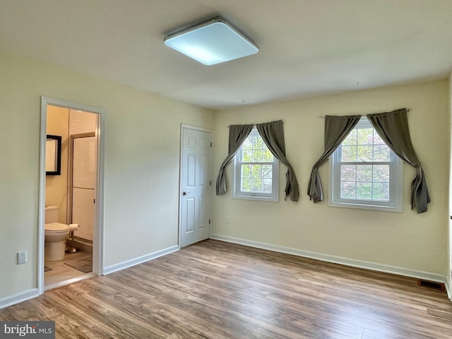 7972 Lakecrest Dr, Greenbelt, MD 20770 - unfurnished bedroom with wood finished floors and baseboards