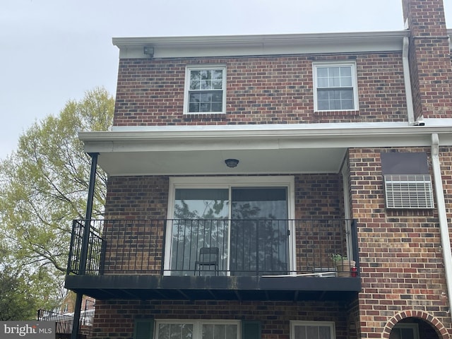 7972 Lakecrest Dr, Greenbelt, MD 20770 - view of home's exterior featuring a balcony and brick siding