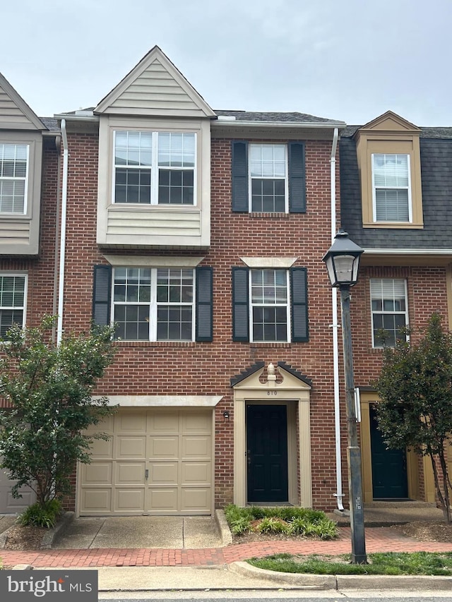 810 N Fayette St, Alexandria, VA 22314 - multi unit property featuring an attached garage, brick siding, and roof with shingles
