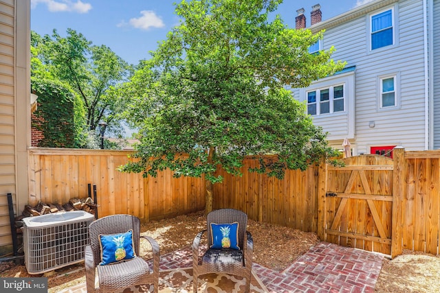 810 N Fayette St, Alexandria, VA 22314 - fenced backyard with central air condition unit, a gate, and a patio