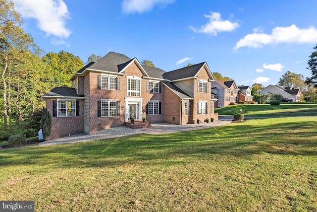 670 Good Shepherd Way, Owings, MD 20736 - rear view of house featuring brick siding and a yard