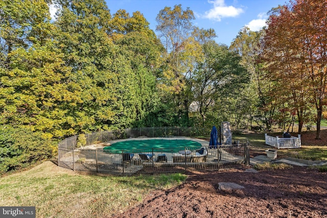 670 Good Shepherd Way, Owings, MD 20736 - view of swimming pool featuring fence, a patio, and a wooded view