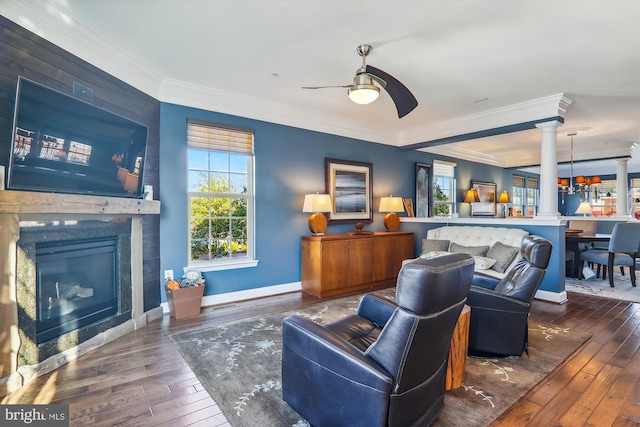 801 Skippers Ln, Annapolis, MD 21401 - living area featuring decorative columns, ornamental molding, a ceiling fan, hardwood / wood-style flooring, and a glass covered fireplace
