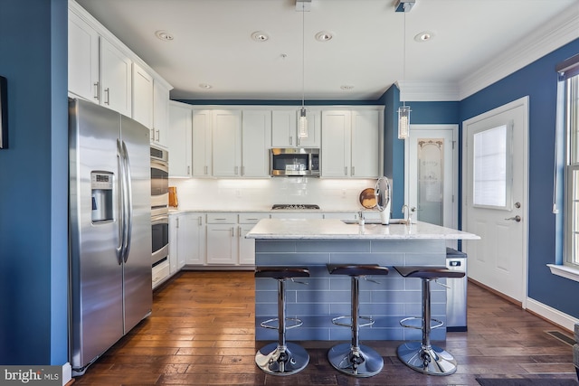 801 Skippers Ln, Annapolis, MD 21401 - kitchen featuring appliances with stainless steel finishes, dark wood-type flooring, white cabinets, a sink, and recessed lighting