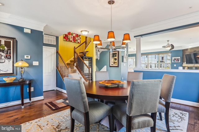 801 Skippers Ln, Annapolis, MD 21401 - dining room with ornate columns, hardwood / wood-style floors, ornamental molding, baseboards, and stairway