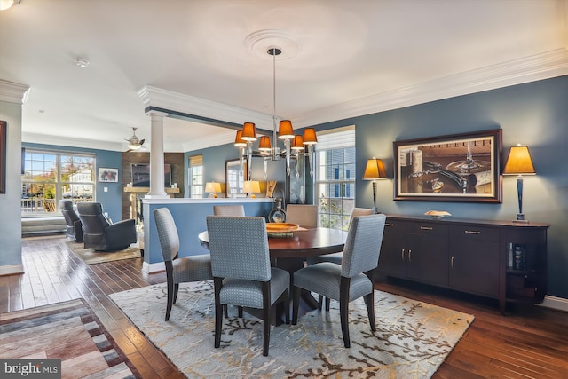 801 Skippers Ln, Annapolis, MD 21401 - dining space featuring decorative columns, hardwood / wood-style floors, crown molding, and baseboards