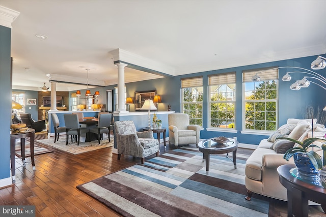 801 Skippers Ln, Annapolis, MD 21401 - living room featuring decorative columns, ornamental molding, hardwood / wood-style flooring, and baseboards