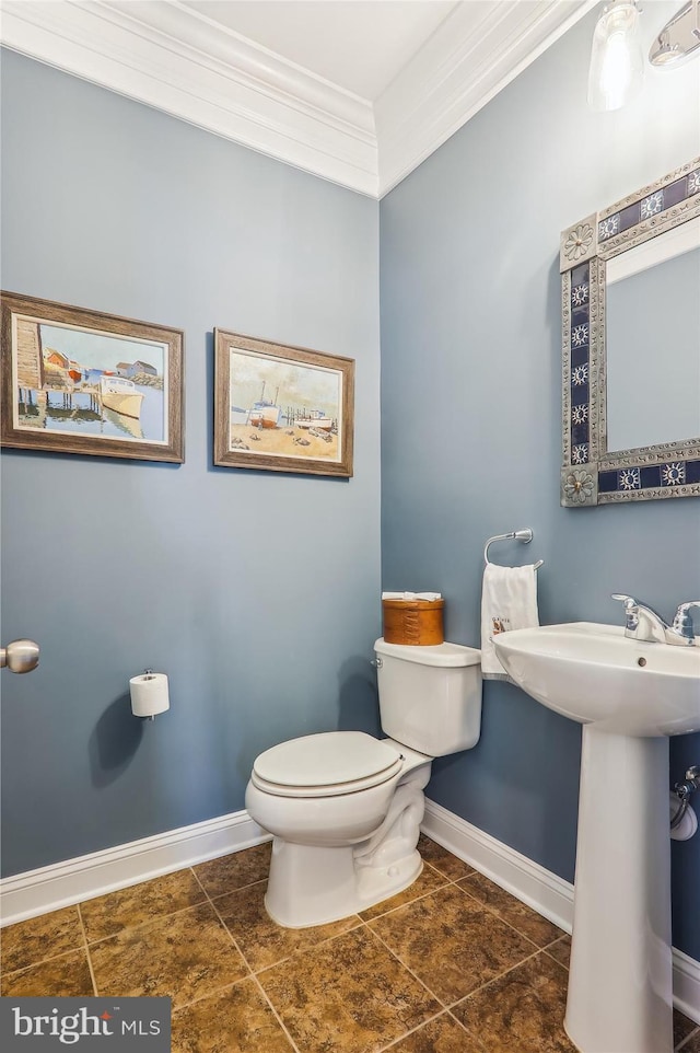801 Skippers Ln, Annapolis, MD 21401 - half bath with toilet, baseboards, crown molding, a sink, and tile patterned flooring