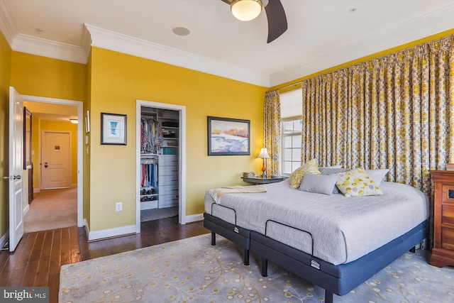 801 Skippers Ln, Annapolis, MD 21401 - bedroom with baseboards, wood-type flooring, ornamental molding, a walk in closet, and a closet