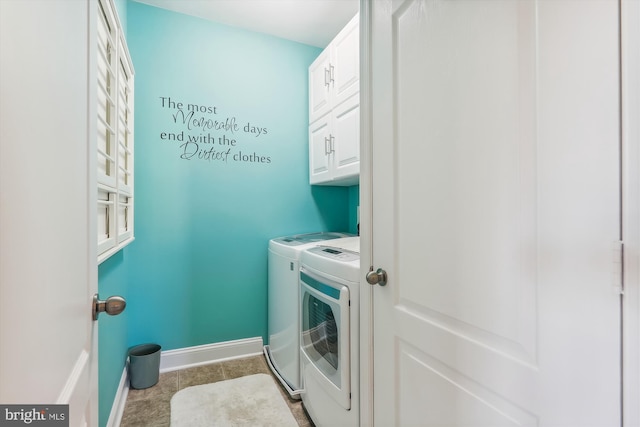 801 Skippers Ln, Annapolis, MD 21401 - washroom with washer and clothes dryer, cabinet space, tile patterned floors, and baseboards