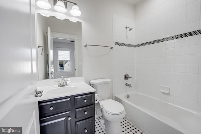 full bath with toilet,  shower combination, vanity, and tile patterned floors