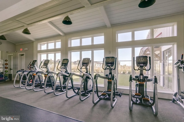 gym with beam ceiling, wooden ceiling, and high vaulted ceiling