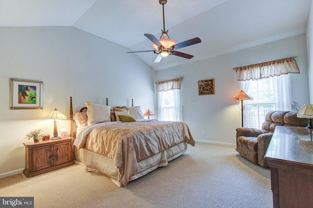 carpeted bedroom with vaulted ceiling, baseboards, and a ceiling fan