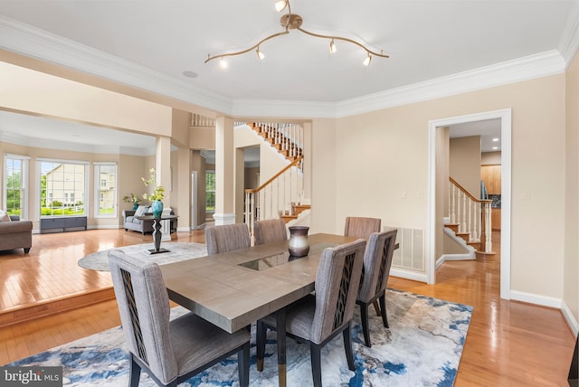 12406 Old Grey Mare Ct, Reisterstown, MD 21136 - dining room featuring stairs, light wood-type flooring, ornamental molding, and baseboards