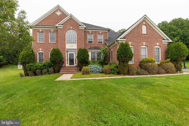 12406 Old Grey Mare Ct, Reisterstown, MD 21136 - colonial house featuring brick siding and a front yard