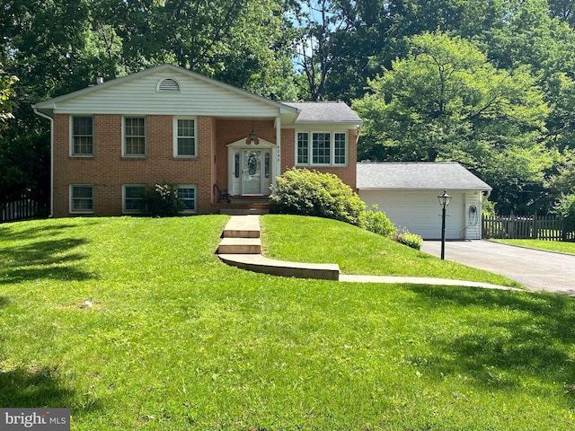 6205 Oak Hill Dr, Sykesville, MD 21784 - view of front of home with brick siding, driveway, and view of wooded area