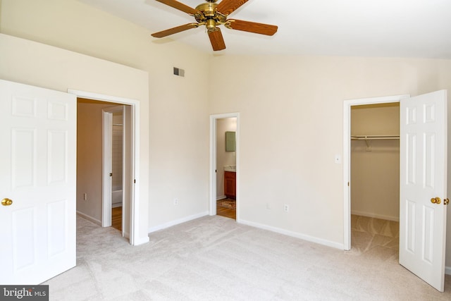 43193 Ribboncrest Ter, Ashburn, VA 20147 - unfurnished bedroom with a spacious closet, light colored carpet, lofted ceiling, a closet, and connected bathroom
