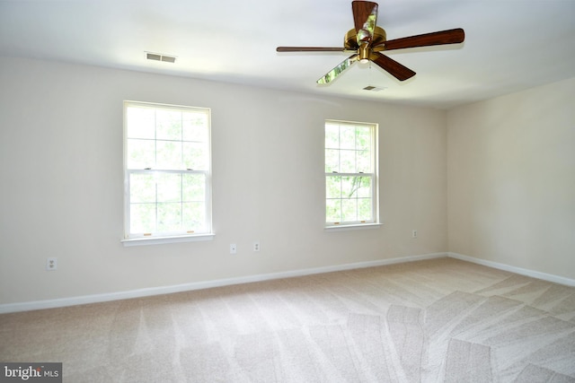 43193 Ribboncrest Ter, Ashburn, VA 20147 - empty room with light colored carpet, plenty of natural light, and a ceiling fan