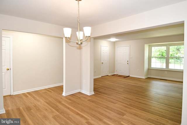 43193 Ribboncrest Ter, Ashburn, VA 20147 - empty room with a chandelier and light wood-type flooring