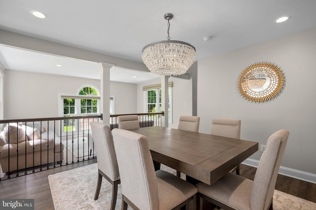 410 Metropolitan Blvd, Pasadena, MD 21122 - dining space featuring dark wood finished floors, a chandelier, recessed lighting, ornate columns, and baseboards