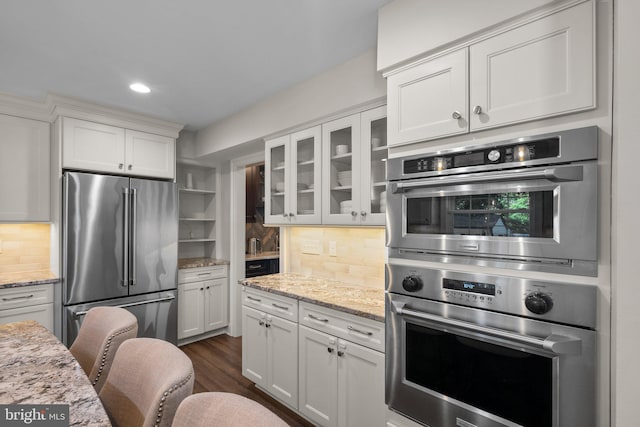 410 Metropolitan Blvd, Pasadena, MD 21122 - kitchen featuring stainless steel appliances, glass insert cabinets, white cabinetry, decorative backsplash, and recessed lighting