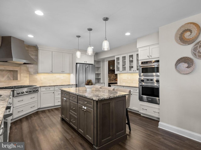 410 Metropolitan Blvd, Pasadena, MD 21122 - kitchen featuring stainless steel appliances, wall chimney exhaust hood, white cabinets, and recessed lighting